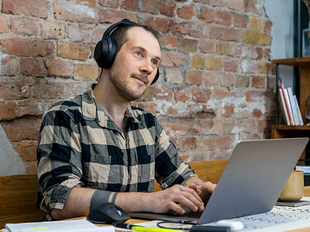 istock Focused professional works from home in a cozy urban space with thoughtful expression 2228762656