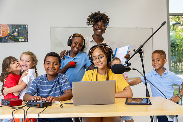 istock Elementary school students recording podcast in classroom 2228763168