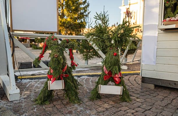 istock Handmade Christmas reindeer decorations made of spruce branches with red bows 2228764233