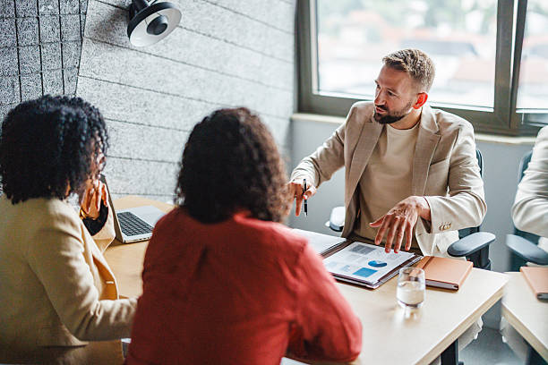 istock Business Meeting with Diverse Clients in Office Setting 2228766549