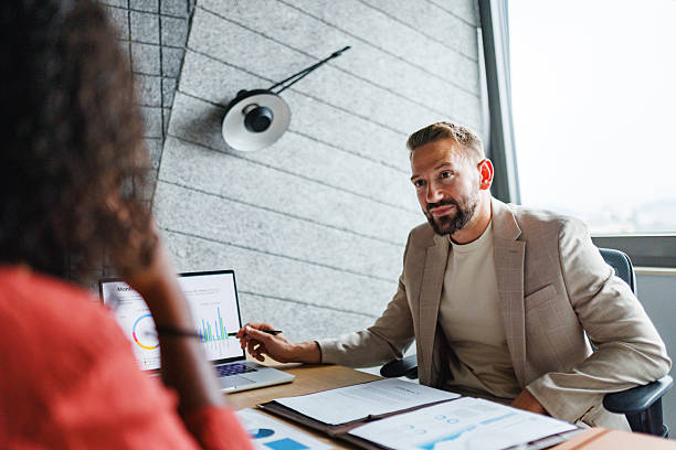 istock Business Advisors in Meeting with Clients 2228766581