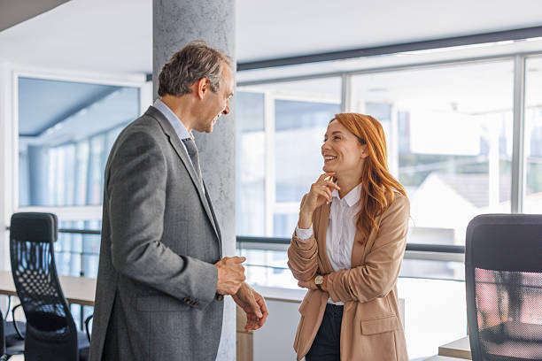 istock Businesspeople having a casual conversation in modern office 2228767720