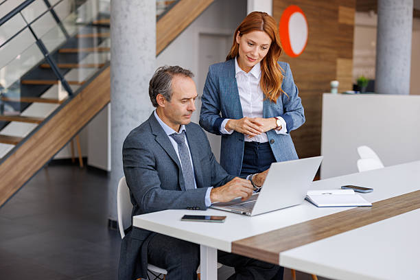 istock Businesspeople working together on laptop in modern office 2228768079