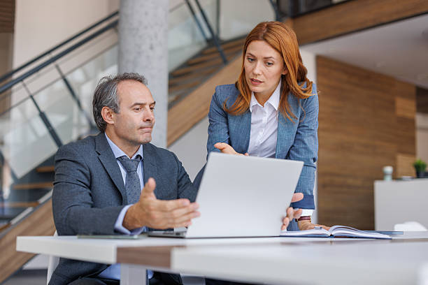 istock Businesspeople discussing over laptop in office 2228768090