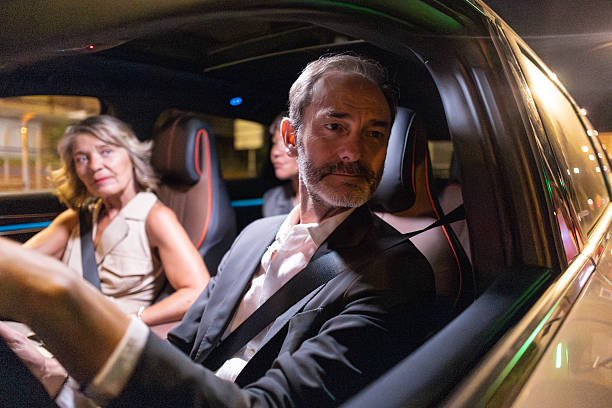 istock Business people sharing ride in autonomous car at night 2228770162
