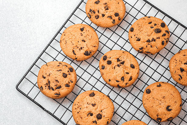 istock Freshly baked chocolate chip cookies cooling on a wire rack 2228774069