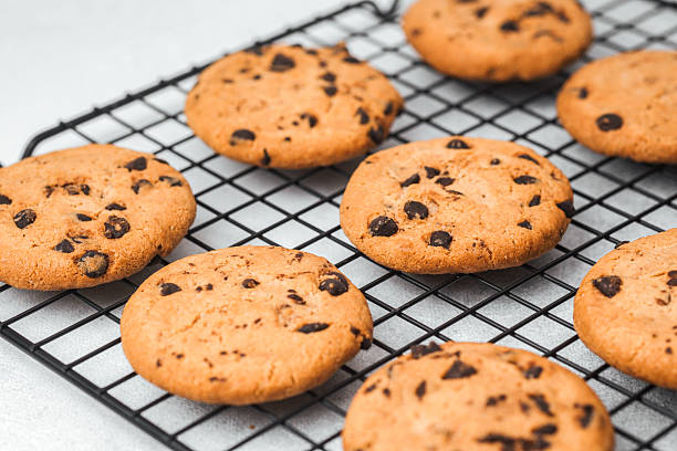 istock Freshly baked chocolate chip cookies cooling on a wire rack 2228774072