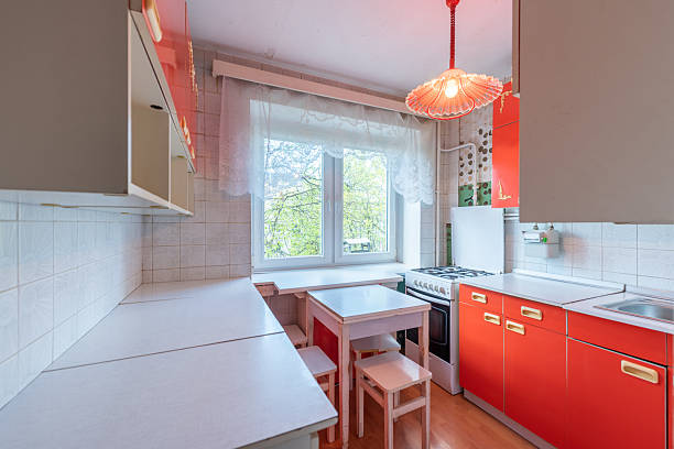 istock Retro Styled Home Kitchen Interior With Bright Red Cabinets and White Accents 2228774144