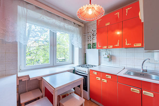 istock Retro Styled Home Kitchen Interior With Bright Red Cabinets and White Accents 2228774217