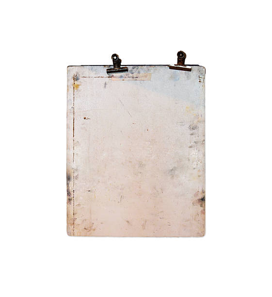 istock An old, stained clipboard with two rusty metal clips isolated on white background. Aged board for design and mockup 2228777529