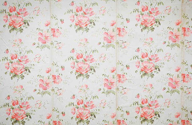 Old wallpaper on the wall. Old wallpaper for texture or background.