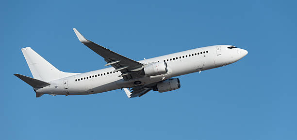 istock Airplane take off on the blue sky, Aircraft flying on sky background 2228779519
