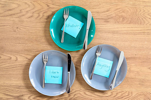 istock Plates with Sticky Notes Saying 'Never Mind', 'I Don't Know', and 'Whatever' – Conceptual Still Life on Emotional Detachment and Apathy 2228780359