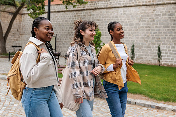 istock Female Friends Strolling in the City After Class 2228780825