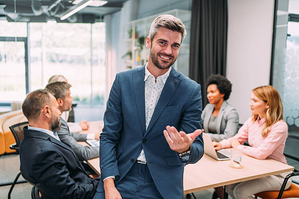 istock Confident businessman and his team. 2228780900