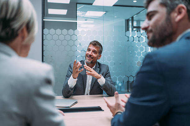 istock Group of business persons talking in the office. 2228780901