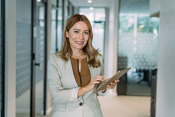 istock Confident businesswoman in modern office. 2228780910