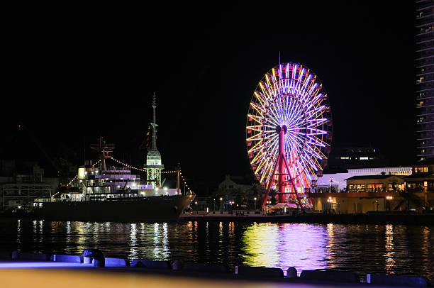 Ferris wheel and harbor night view at night in Kobe, Japan