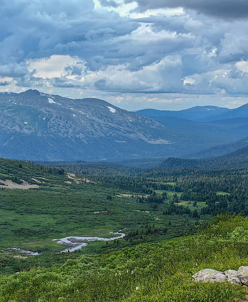istock Panoramic view of mountains and valleys under a dramatic cloudy sky 2228782347