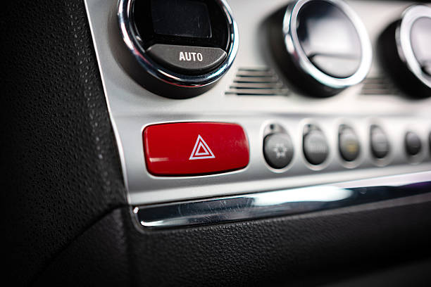 istock Car emergency stop or hazard lights button on dashboard. Close up shot, no people 2228782903