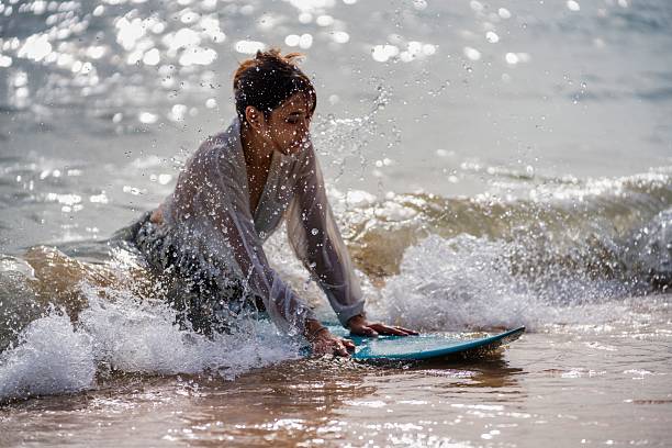 istock Exciting surfing experience in the ocean during a sunny afternoon with splashing waves 2228783494