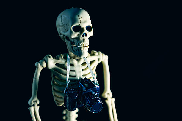 istock Photography is Dead Halloween Skeleton With Camera Humor Concept 2228783896