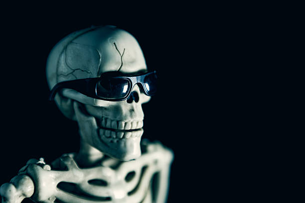 A humorous image of a skeleton in sunglasses looking off to the side.