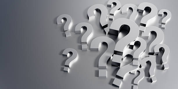 istock Pile of silver Question Marks on golden background 2228785548