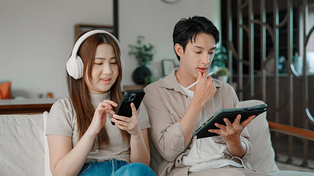 istock Asian couple relaxing at home 2228786544