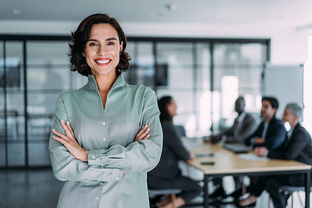 istock Confident businesswoman and her team. 2228787488