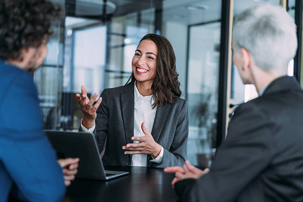 istock Group of business persons talking in the office. 2228787520