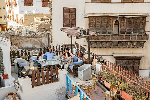 istock Friends sitting around a table at a rooftop restaurant in Al- Balad Jeddah 2228788224