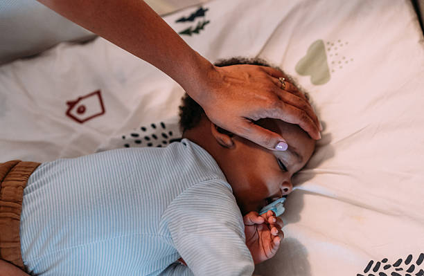 istock Mother and her sick little son at home. 2228790135