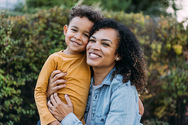 istock Cheerful mother with her son outdoor. 2228790142