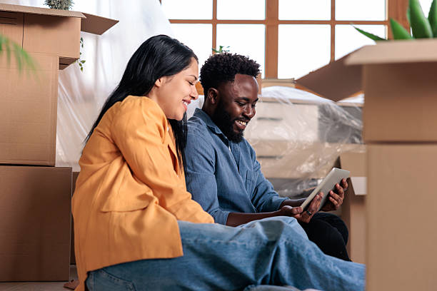 istock Smiling Couple Using Tablet to Connect Home to Internet 2228790739