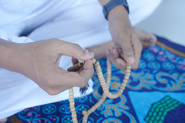 istock A man holds a prayer beads. Islamic prayer beads at home. 2228791445