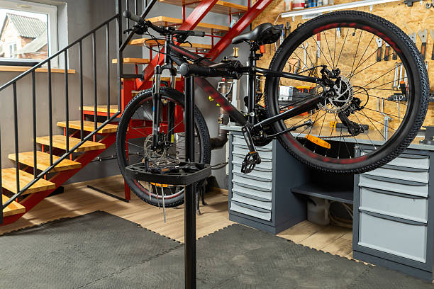istock Bicycle in home garage workshop on stand surrounded by tools and equipment 2228794365