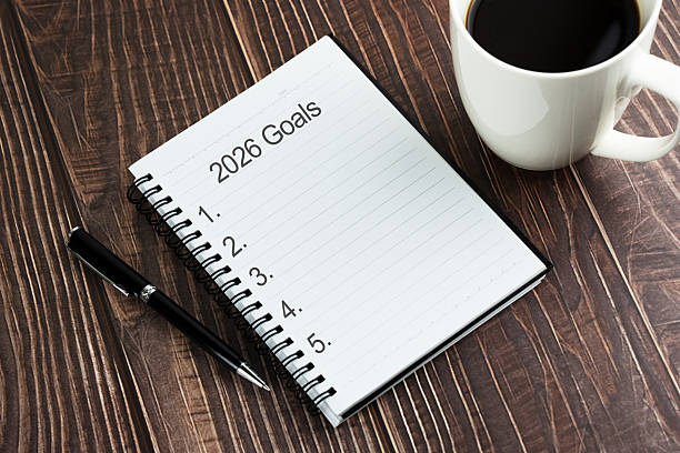 istock Cup of coffee and 2026 goals lists on notepad 2228795947