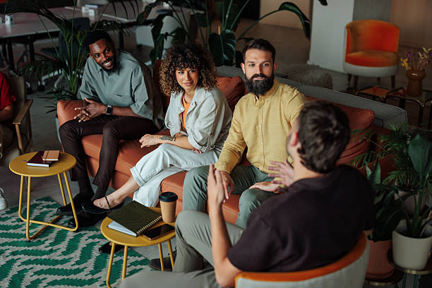 istock Coworkers having an informal meeting in a modern office space 2228796837