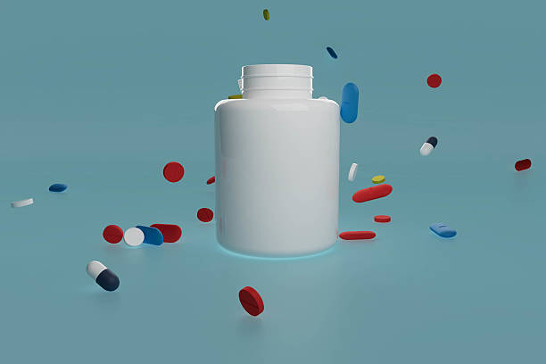 istock A white pill bottle with a blue, red, and yellow pill inside 2228797771