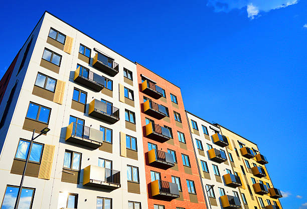 istock Balconies on blue sky, view up. New Apartment facade. 2228799528
