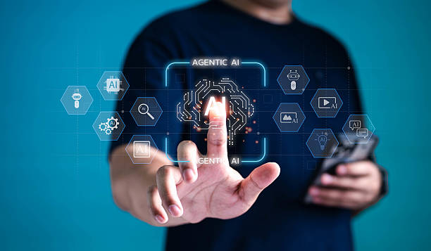 istock Businessman using futuristic interface to activate AGENTIC AI technology with fingertip. Innovative artificial intelligence system, automation, and machine learning concept. 2228801317