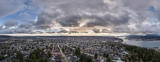 istock Panoramic Aerial View of a Cityscape Under a Cloudy Sky 2228802252