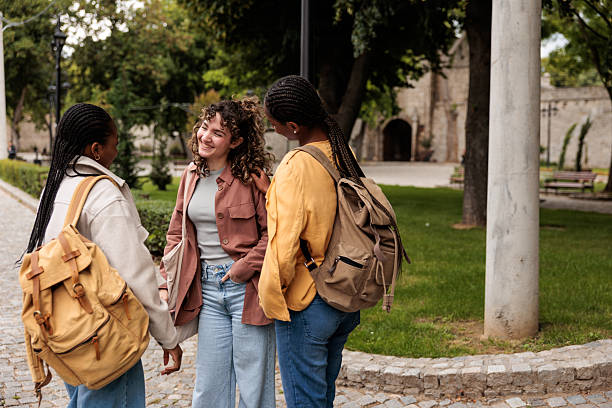 istock Diverse Female Friends Standing and Chatting on Sidewalk 2228803150