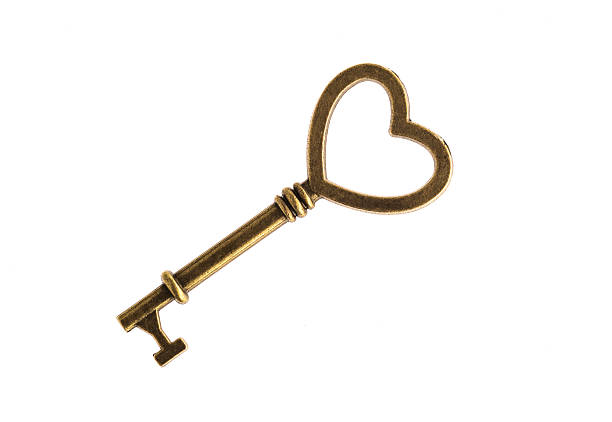 istock Single heart shaped old vintage door key isolated on white background 2228805738