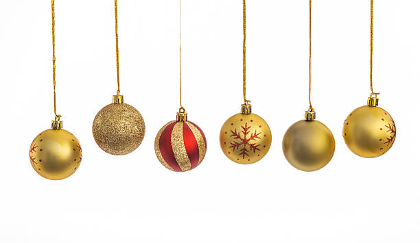 istock Golden Christmas balls hanging in a row 2228805944