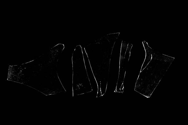 istock Several pieces of broken glass on a black background. 2228806507