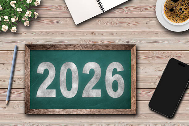 istock Decoration with office table top view and board for New Year 2026 with text. 2228807148