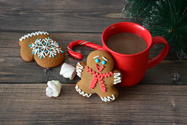 Gingerbread Man and Festive Treats with Cocoa in a Red Mug