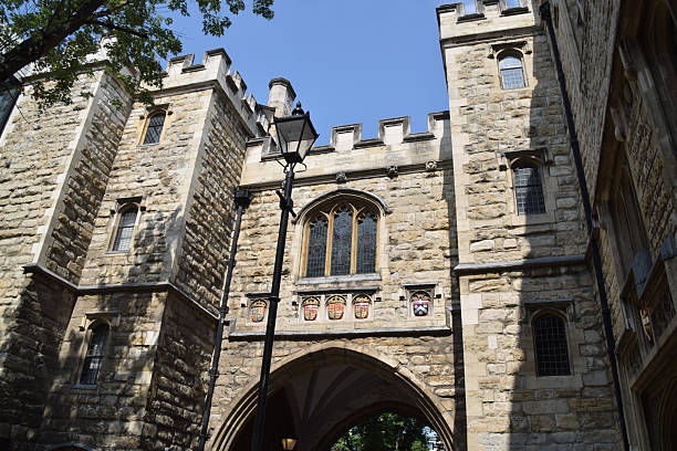 London, UK - August 6 2025: St John's Gate, a historic medieval stone gate in Clerkenwell.